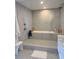 Modern bathroom featuring a glass-enclosed shower and luxurious soaking tub at 330 Concord St # 5D & 5E, Charleston, SC 29401