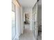 Bright hallway leading to a room with large windows and natural light at 330 Concord St # 5D & 5E, Charleston, SC 29401