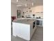 Bright kitchen featuring a central island with marble countertop and modern cabinetry at 330 Concord St # 5D & 5E, Charleston, SC 29401