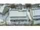 Winter aerial view of a multi-unit building with snow covering the roof and surrounding landscape at 333 Flyway Rd, Goose Creek, SC 29445