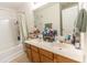 Bright bathroom featuring a double vanity with plentiful counter space and a large mirror at 333 Flyway Rd, Goose Creek, SC 29445