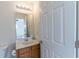 Bathroom featuring a vanity with a sink and view into an adjacent bedroom with ceiling fan at 333 Flyway Rd, Goose Creek, SC 29445