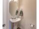 Pedestal sink with oval mirror, towel and soap dispenser at 333 Flyway Rd, Goose Creek, SC 29445