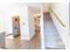 Bright entryway features staircase, wood floors, and a view into the kitchen at 333 Flyway Rd, Goose Creek, SC 29445