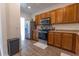 Modern kitchen with stainless steel appliances, wood cabinets, and wood-look flooring at 333 Flyway Rd, Goose Creek, SC 29445