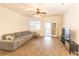 Spacious living room with wood floors, large sectional sofa, and sliding glass doors at 333 Flyway Rd, Goose Creek, SC 29445
