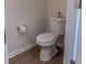 Clean, white toilet with wood-look floor in half bathroom at 333 Flyway Rd, Goose Creek, SC 29445