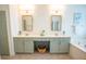 Bright bathroom with double vanity, framed mirrors, and a soaking tub for a spa-like experience at 3439 Toomer Kiln Cir, Mount Pleasant, SC 29466