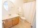 Cozy bathroom featuring a vanity with stylish round mirror and shower with a curtain at 3439 Toomer Kiln Cir, Mount Pleasant, SC 29466