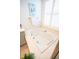 Bright bathroom featuring a tub next to a window with white blinds at 3439 Toomer Kiln Cir, Mount Pleasant, SC 29466