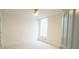 Bright bedroom features a ceiling fan, a window letting in natural light, and neutral carpeting at 3439 Toomer Kiln Cir, Mount Pleasant, SC 29466