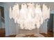 View of the dining room featuring a stunning modern chandelier and hardwood floors at 3439 Toomer Kiln Cir, Mount Pleasant, SC 29466