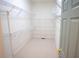 Walk-in closet with shelving, neutral carpet, and a door with gold hardware at 3439 Toomer Kiln Cir, Mount Pleasant, SC 29466