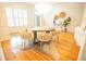 Elegant dining room featuring a modern chandelier, round table, and decorative rug, and light-filled windows at 3439 Toomer Kiln Cir, Mount Pleasant, SC 29466