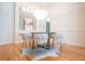 Inviting dining room with a modern chandelier, stylish chairs, and bright hardwood floors at 3439 Toomer Kiln Cir, Mount Pleasant, SC 29466