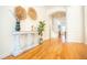 Bright entryway with stylish console table, decor, and hardwood floors at 3439 Toomer Kiln Cir, Mount Pleasant, SC 29466