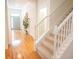 Inviting foyer with hardwood floors, staircase, and a view of the front door at 3439 Toomer Kiln Cir, Mount Pleasant, SC 29466