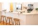 Kitchen bar featuring seating for three, sleek countertops, and white cabinetry at 3439 Toomer Kiln Cir, Mount Pleasant, SC 29466