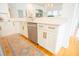 Bright kitchen with stainless steel appliances, stylish countertops, and decorative rug on the hardwood floor at 3439 Toomer Kiln Cir, Mount Pleasant, SC 29466