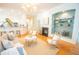 Open living room showcases hardwood floors, fireplace, and contemporary furnishings to enjoy with company at 3439 Toomer Kiln Cir, Mount Pleasant, SC 29466
