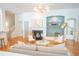 Open living room with hardwood floors, fireplace, built-in shelves, and contemporary furnishings at 3439 Toomer Kiln Cir, Mount Pleasant, SC 29466