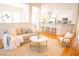 Open concept living room with kitchen, bar seating, and a comfortable couch at 3439 Toomer Kiln Cir, Mount Pleasant, SC 29466