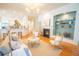Open living room with hardwood floors, fireplace, built-in shelves, and contemporary furnishings at 3439 Toomer Kiln Cir, Mount Pleasant, SC 29466