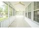 Relaxing screened porch with ceiling fans and views of the lush greenery, ideal for outdoor enjoyment at 3439 Toomer Kiln Cir, Mount Pleasant, SC 29466