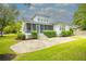 Expansive backyard with stone patio and screened porch, perfect for outdoor entertaining at 3439 Toomer Kiln Cir, Mount Pleasant, SC 29466