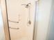 Modern shower featuring glass doors, sleek fixtures, and accessibility bars at 3439 Toomer Kiln Cir, Mount Pleasant, SC 29466