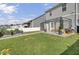 Expansive backyard with a large pergola, a well-kept lawn, and garden beds at 3990 Hillyard St, North Charleston, SC 29405