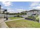 Well-maintained backyard with green grass, pathway, and a white privacy fence at 3990 Hillyard St, North Charleston, SC 29405