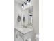 Bright bathroom featuring a quartz countertop and modern vanity with gold hardware at 3990 Hillyard St, North Charleston, SC 29405