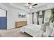 Bright bedroom features tray ceiling, fan, hard wood dresser, TV and access to the outside at 3990 Hillyard St, North Charleston, SC 29405