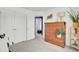 Bright bedroom features a large wooden dresser, a window with curtains and access to an ensuite bathroom at 3990 Hillyard St, North Charleston, SC 29405