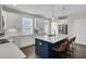 Modern kitchen with an island, ample counter space, and stainless-steel appliances, perfect for cooking and gathering at 3990 Hillyard St, North Charleston, SC 29405