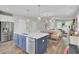 Modern kitchen island view that opens into dining and living areas, offering ample space and natural light at 3990 Hillyard St, North Charleston, SC 29405