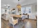 Bright, modern living room flows seamlessly into the dining area, perfect for entertaining guests at 3990 Hillyard St, North Charleston, SC 29405