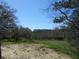Picturesque backyard with a wooded area and beautiful blue skies, perfect for nature lovers at 404 Fairington Dr, Summerville, SC 29485