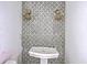 Traditional bathroom with art deco wallpaper, sink, and wicker sconces at 404 Fairington Dr, Summerville, SC 29485