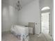 A dining room is under construction with a chandelier and a doorway view to another room at 404 Fairington Dr, Summerville, SC 29485