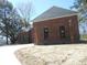 This brick home features a new roof, complemented by elegant palm trees and black-trimmed windows at 404 Fairington Dr, Summerville, SC 29485