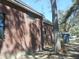 Side view of a brick home featuring black framed windows and an architectural design at 404 Fairington Dr, Summerville, SC 29485