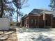 The home is a brick facade with black trim windows, complemented by a concrete driveway at 404 Fairington Dr, Summerville, SC 29485