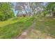 Brick home on a hill with mature trees, creating a serene, private setting at 404 Fairington Dr, Summerville, SC 29485