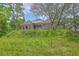 Well-maintained brick house on a grassy hill with mature trees and a blue sky backdrop at 404 Fairington Dr, Summerville, SC 29485