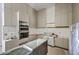 This modern kitchen features stainless steel appliances and sleek cabinets ready for all your culinary creations at 404 Fairington Dr, Summerville, SC 29485