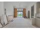 Bright living room features large windows, modern light fixture, and an open floor plan awaiting customization at 404 Fairington Dr, Summerville, SC 29485