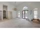 Spacious living room featuring high ceilings and large windows, ready for personalization and customization at 404 Fairington Dr, Summerville, SC 29485