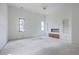 Expansive living room showcasing natural light, recessed shelves, and modern chandelier at 404 Fairington Dr, Summerville, SC 29485